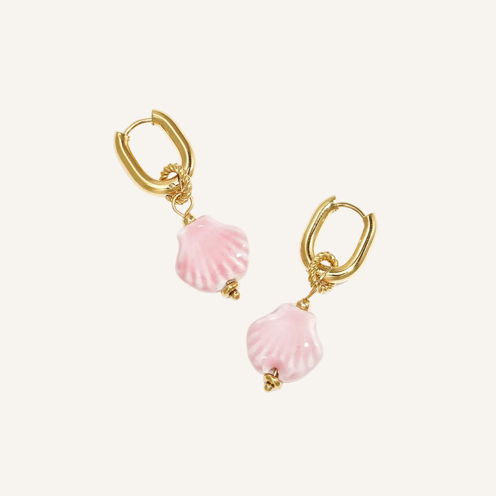 gold huggies with pink shell charm