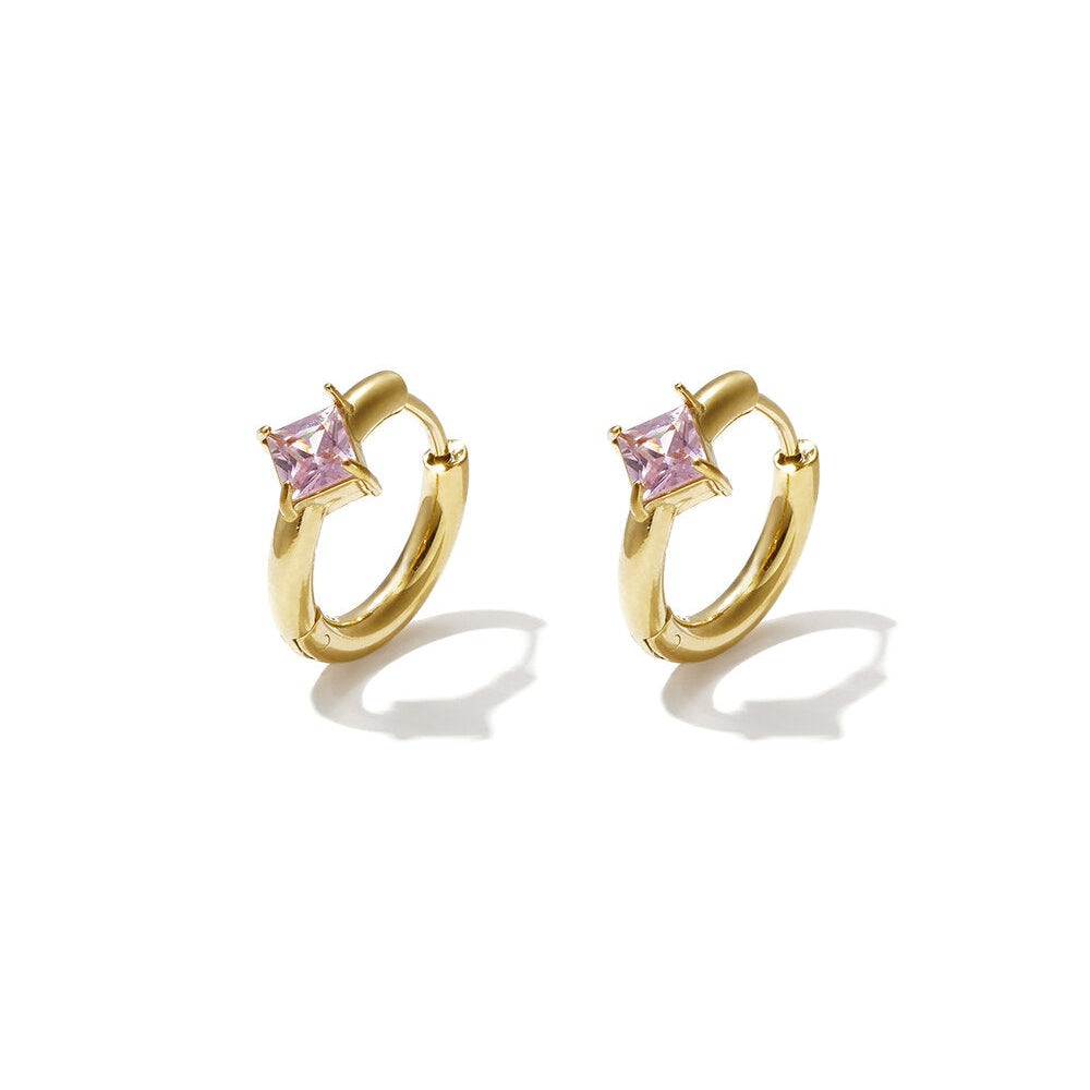 Gold huggie earrings with square blush-pink zircon stones.