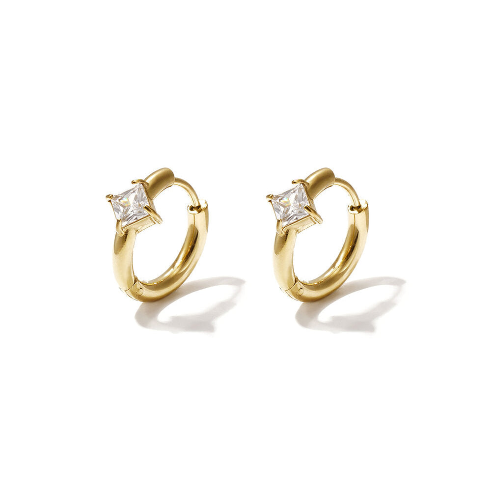 Gold huggie earrings with square clear zircon stones.
