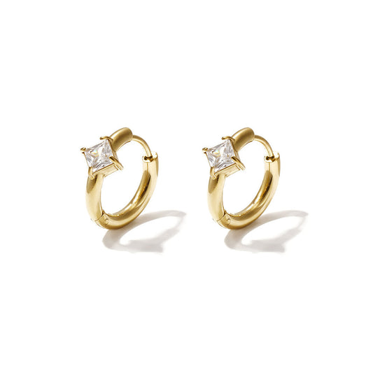 Gold huggie earrings with square clear zircon stones.
