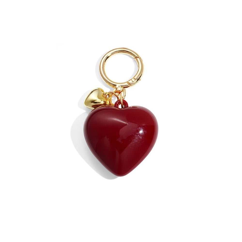 heart-shaped keychain with gold ring and clasp on white background