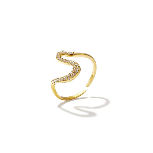 Gold open wave ring with a curved row of clear sparkling stones.