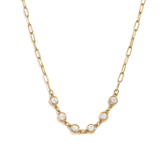 Gold paperclip chain necklace with five clear round bezel-set stones.
