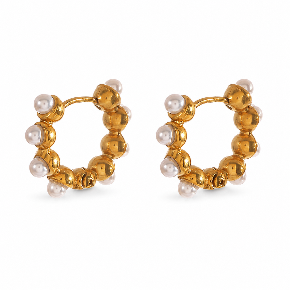 Petite gold huggie hoop earrings decorated with a delicate row of small white pearls.
