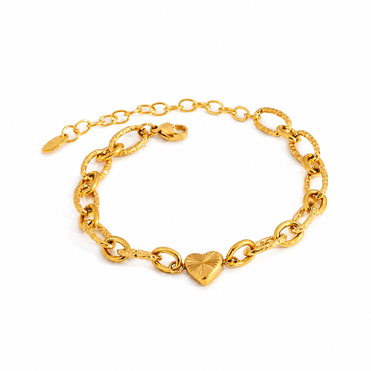 Gold textured link bracelet with a petite heart charm and adjustable extender chain.