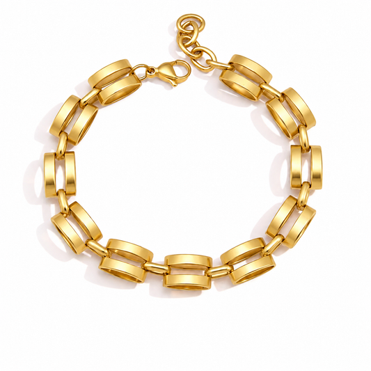 Gold statement bracelet featuring chunky double links with a polished finish and adjustable extender chain.