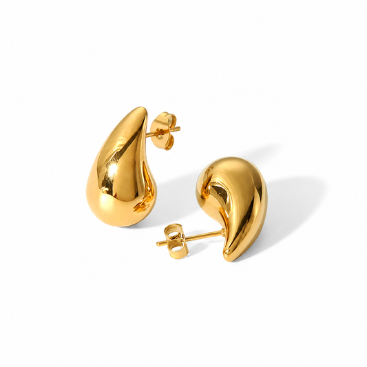 Polished gold sculptural stud earrings with a curved teardrop shape and smooth high-shine finish