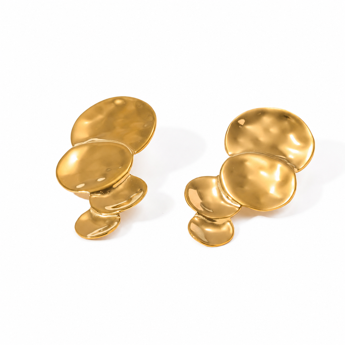Gold statement drop earrings featuring cascading organic discs with a textured sculptural finish