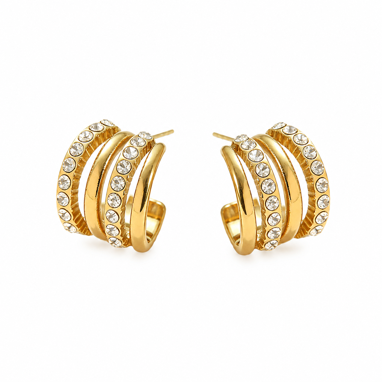 Gold layered hoop earrings with rows of clear sparkling stones