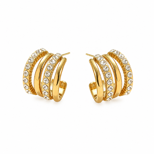 Gold layered hoop earrings with rows of clear sparkling stones