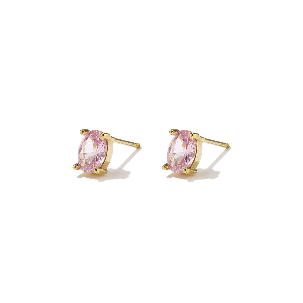Gold stud earrings with oval blush-pink zircon stones in polished gold settings.