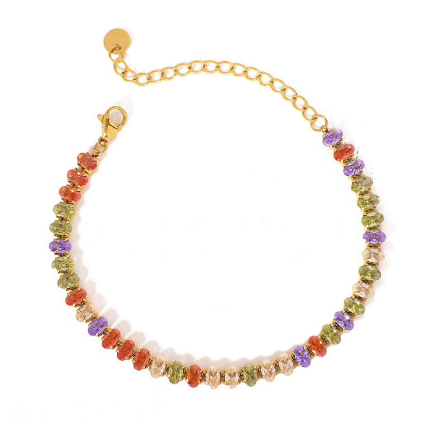 Delicate gold-tone bracelet with multicolour faceted gemstone beads in shades of green, orange, purple, and champagne, featuring an adjustable chain clasp
